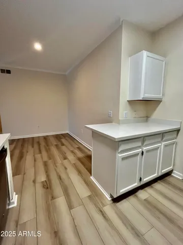 a utility room with cabinets