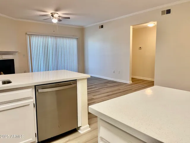 a room with a bed and a chandelier