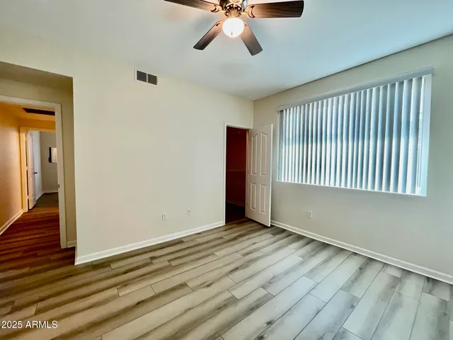 a view of an empty room with a window