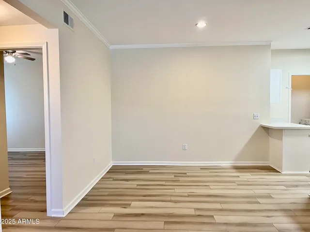 a view of a room with wooden floor