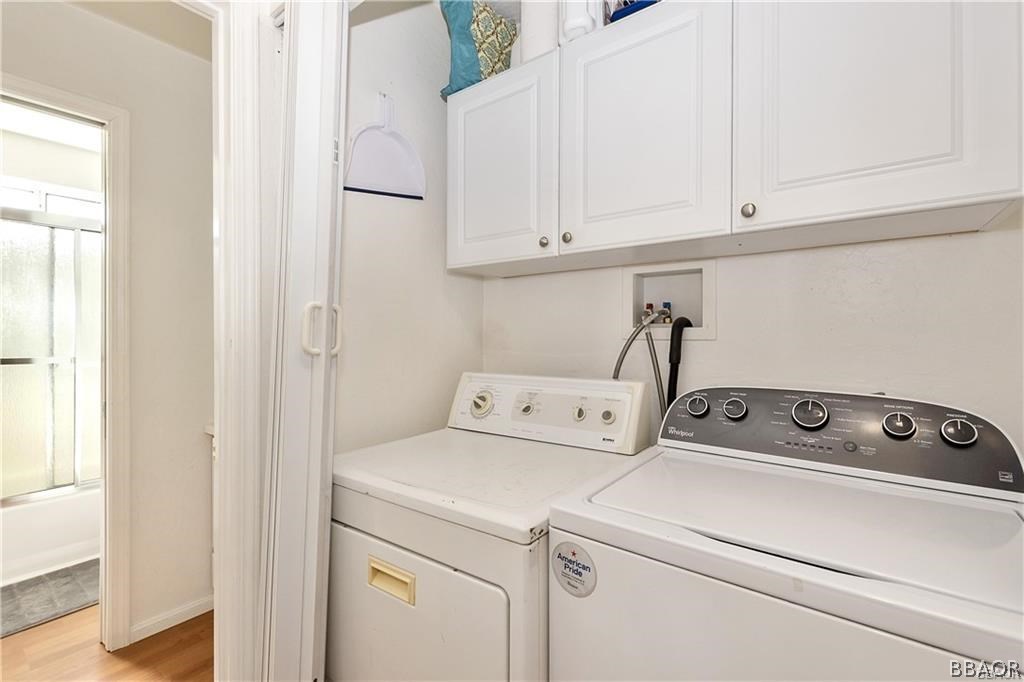 39665 Flicker Road Fawnskin, CA 92333 - Photo 18 of 29 a view of storage and utility room with washer and dryer