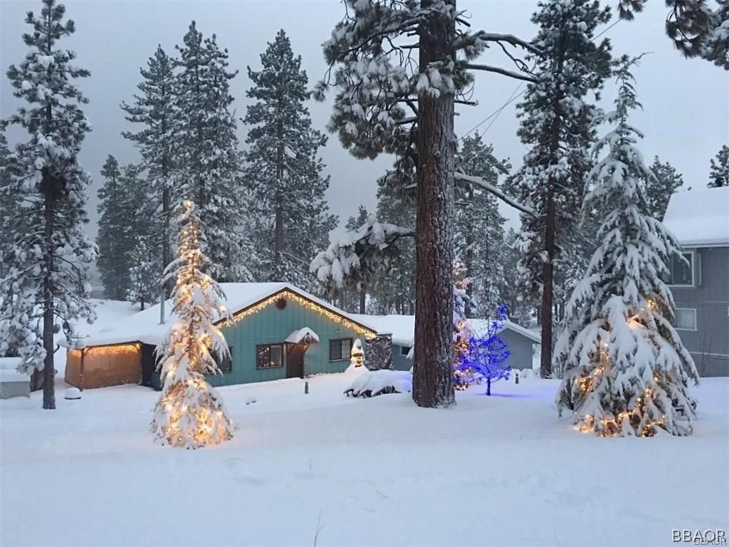 39665 Flicker Road Fawnskin, CA 92333 - Photo 2 of 29 a front view of a house with a yard and trees
