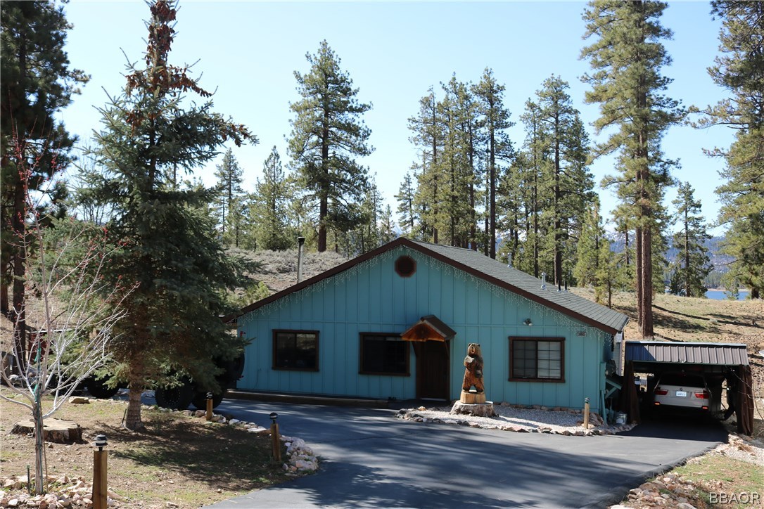 39665 Flicker Road Fawnskin, CA 92333 - Photo 21 of 29 a front view of house with yard and trees around