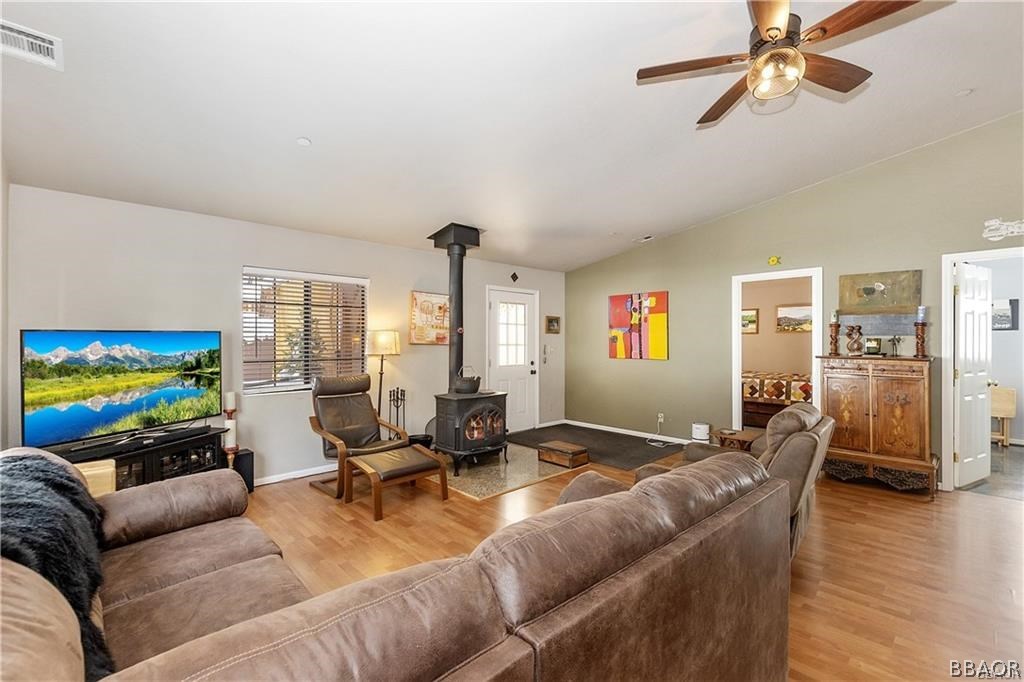 39665 Flicker Road Fawnskin, CA 92333 - Photo 3 of 29 a living room with furniture and a flat screen tv
