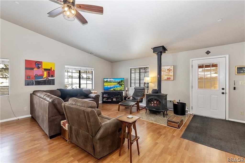 39665 Flicker Road Fawnskin, CA 92333 - Photo 4 of 29 a living room with furniture and a flat screen tv