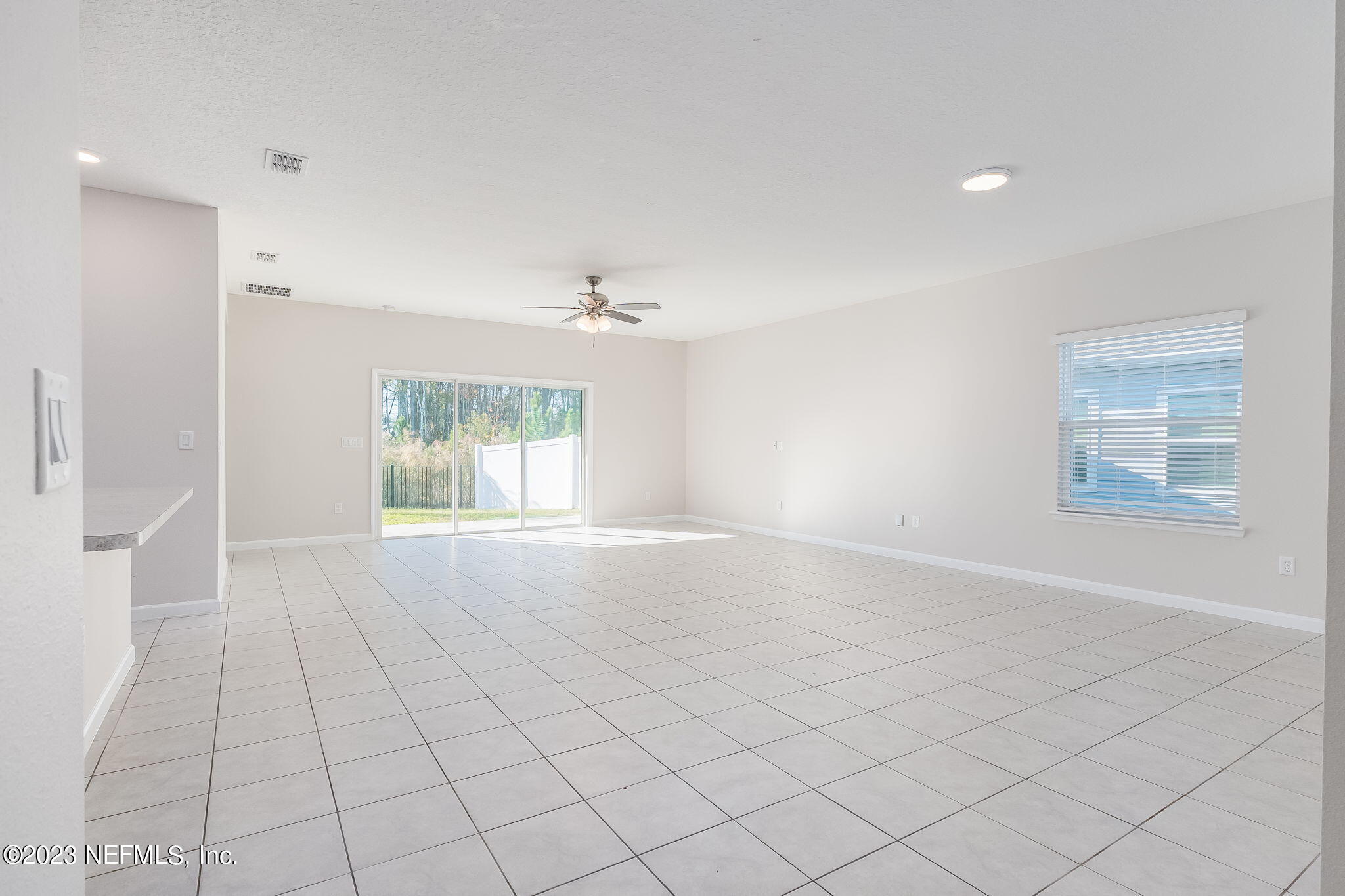 5556 Kellar Circle Jacksonville, FL 32218 - Photo 5 of 28 an empty room with windows