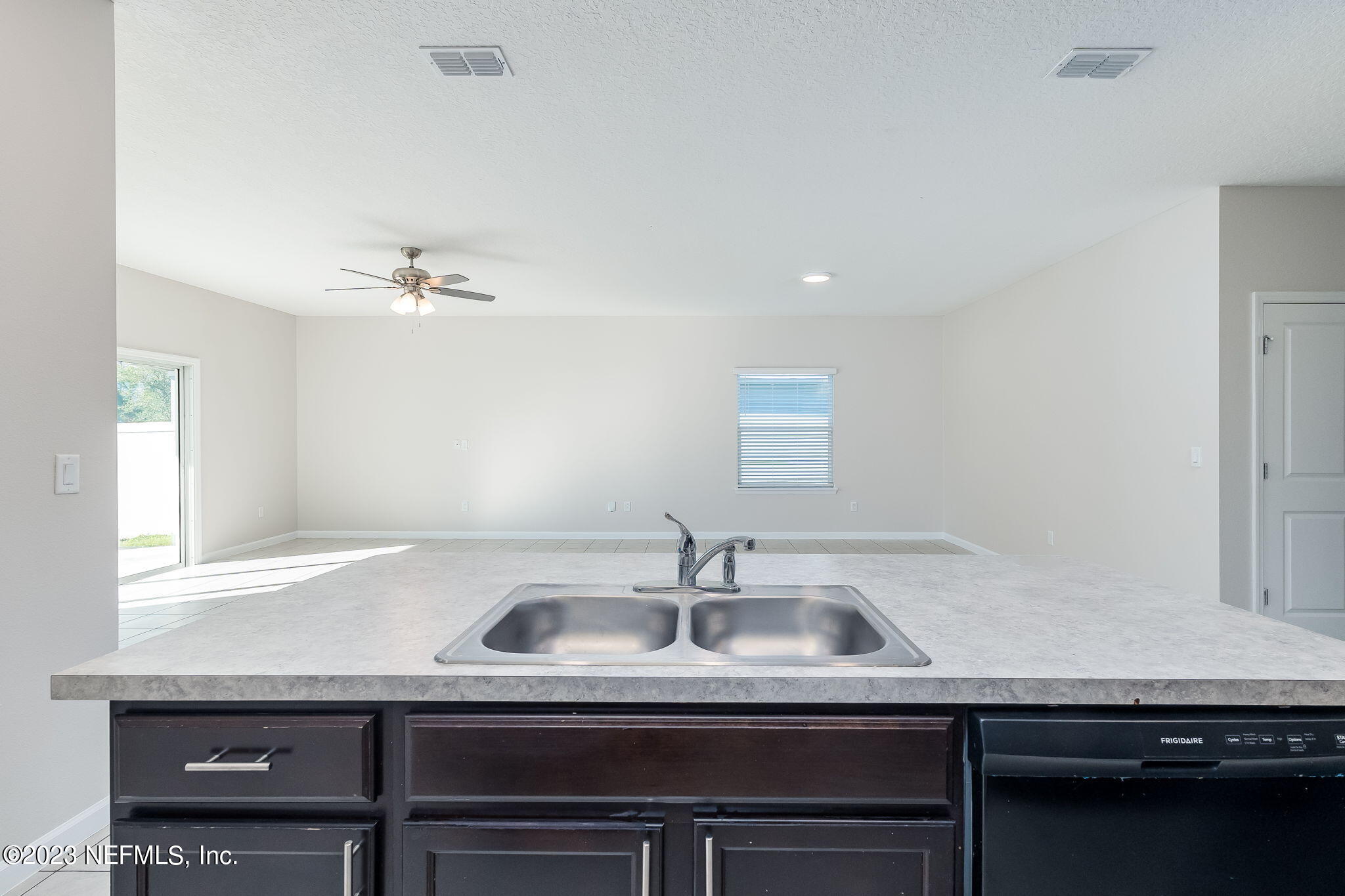 5556 Kellar Circle Jacksonville, FL 32218 - Photo 10 of 28 a kitchen with a sink and cabinets