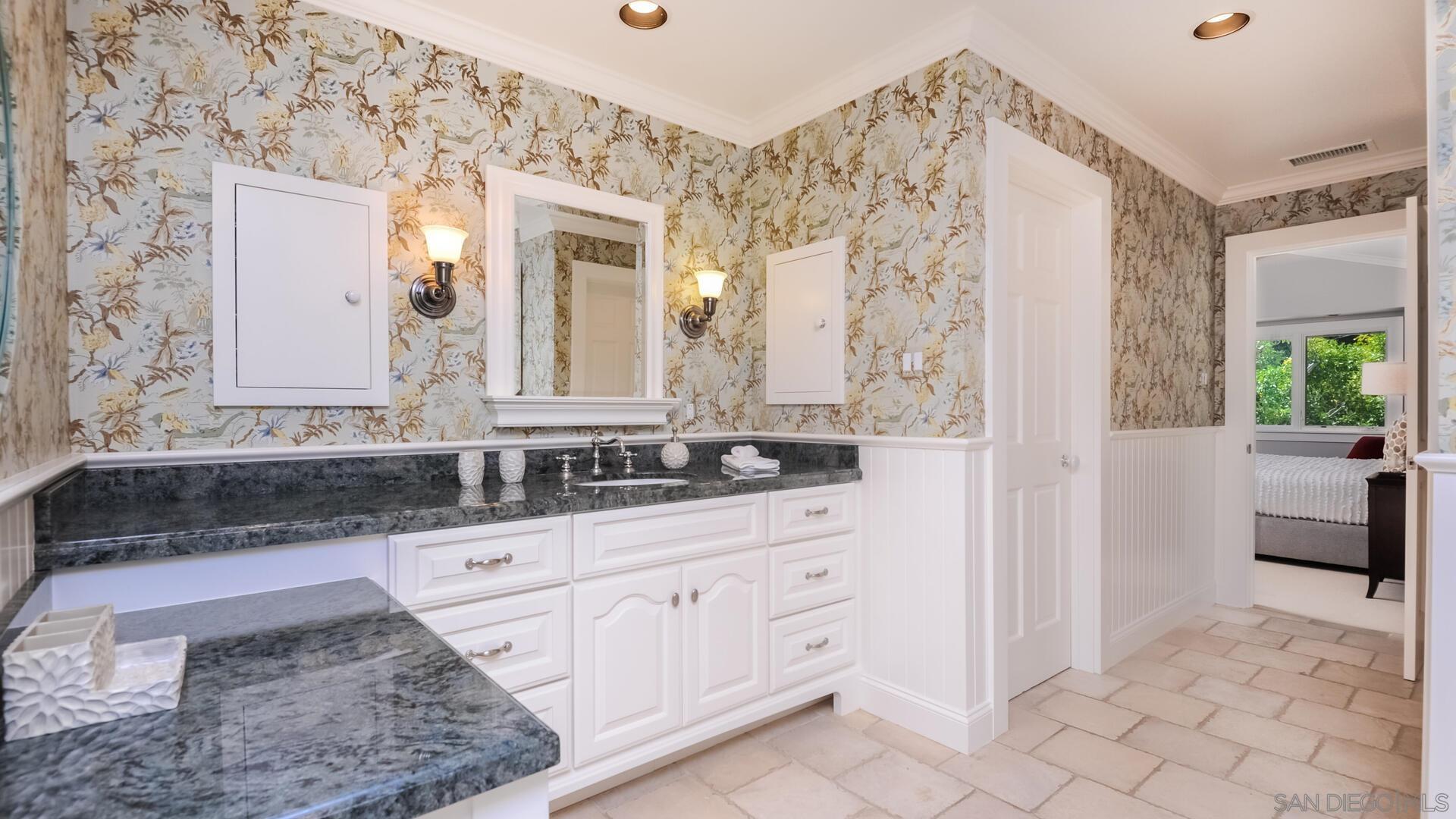 6571 Mimulus Rancho Santa Fe, CA 92067 - Photo 15 of 25 a bathroom with a sink and a mirror