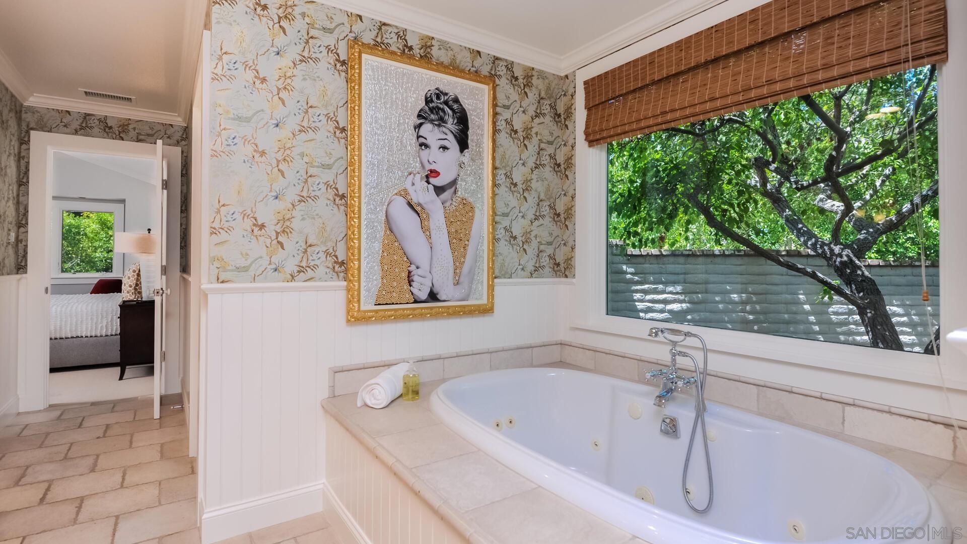 6571 Mimulus Rancho Santa Fe, CA 92067 - Photo 16 of 25 a bathroom with a tub and a window