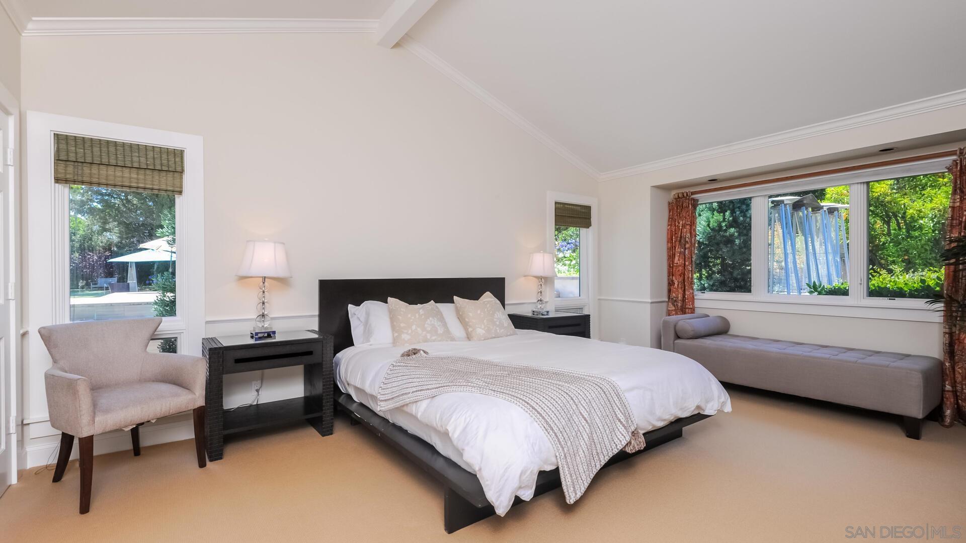 6571 Mimulus Rancho Santa Fe, CA 92067 - Photo 18 of 25 a bedroom with a bed and a large window