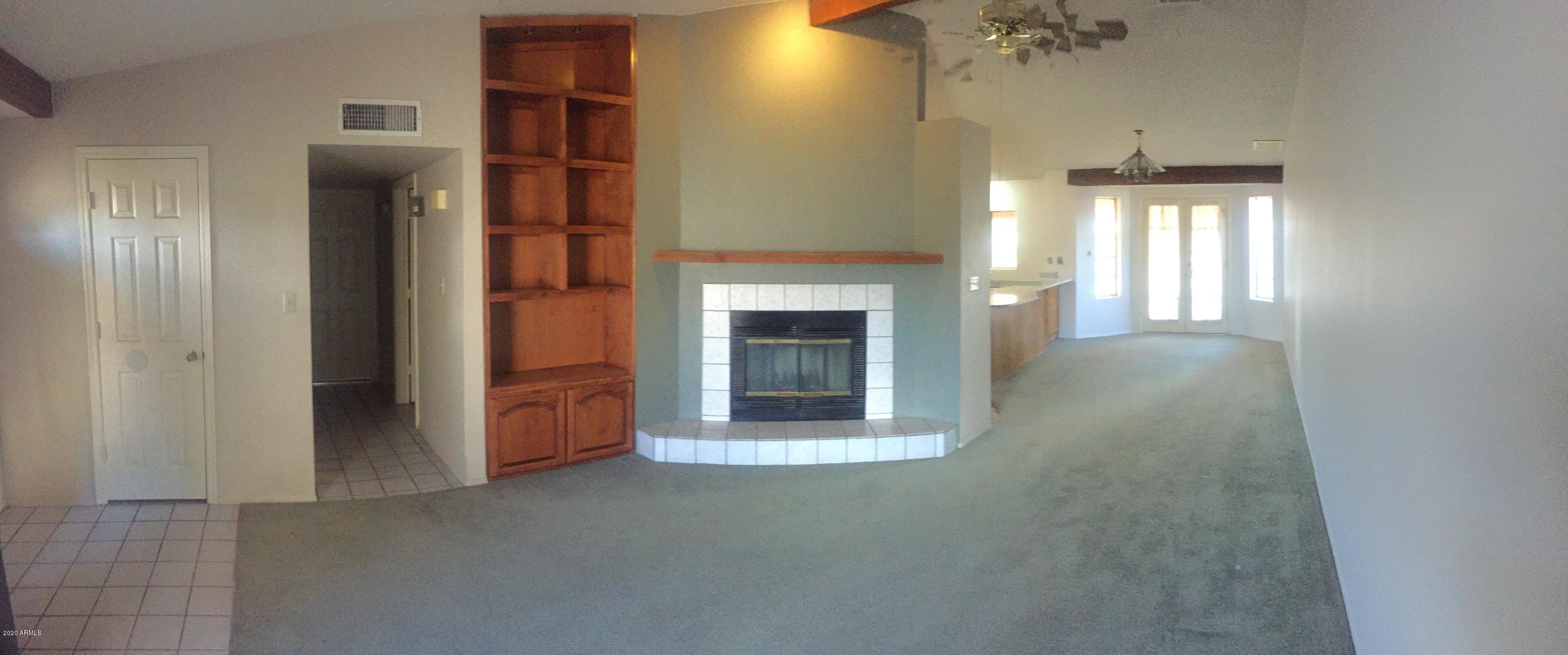 14610 North 40th Place Phoenix, AZ 85032 - Photo 2 of 8 Front room and fireplace