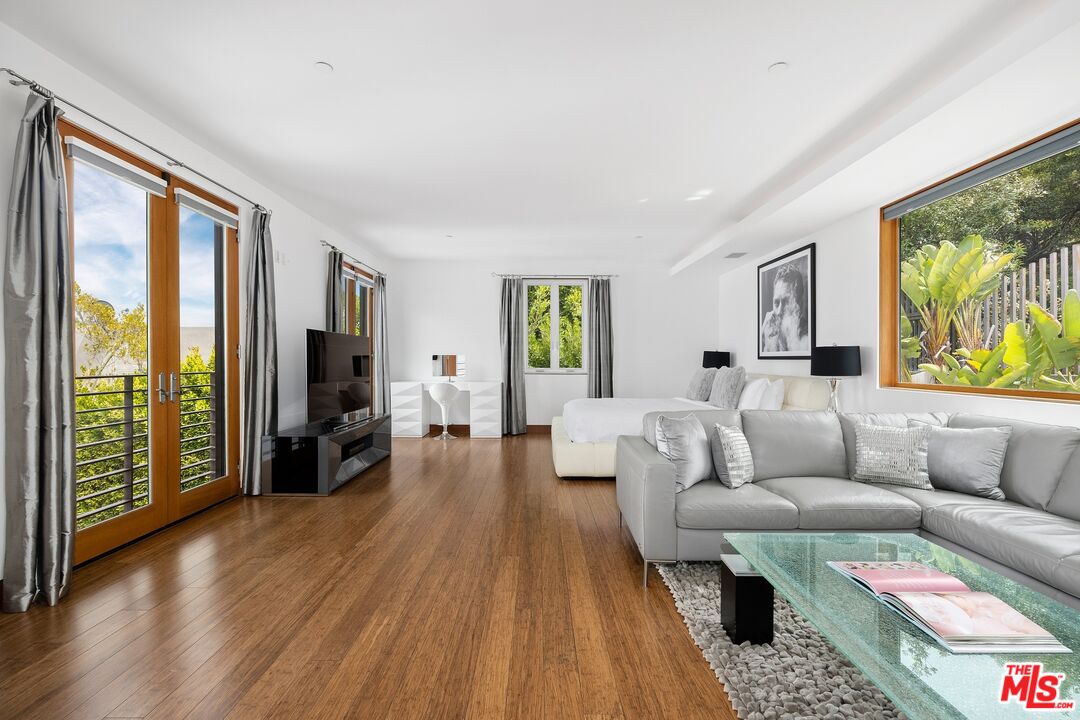 2437 Apollo Drive Los Angeles, CA 90046 - Photo 11 of 27 a living room with furniture and a flat screen tv with wooden floor