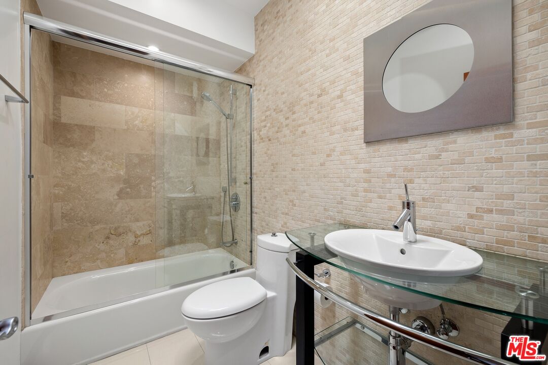 2437 Apollo Drive Los Angeles, CA 90046 - Photo 23 of 27 a bathroom with a sink a toilet and a mirror