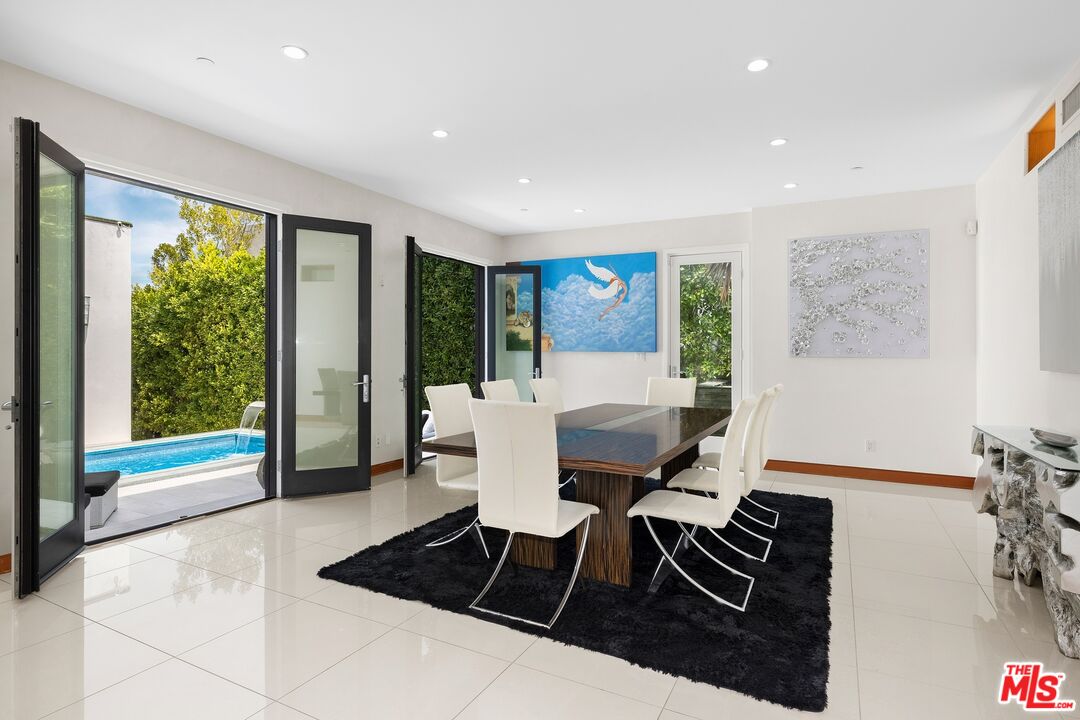 2437 Apollo Drive Los Angeles, CA 90046 - Photo 6 of 27 a living room with furniture and large windows