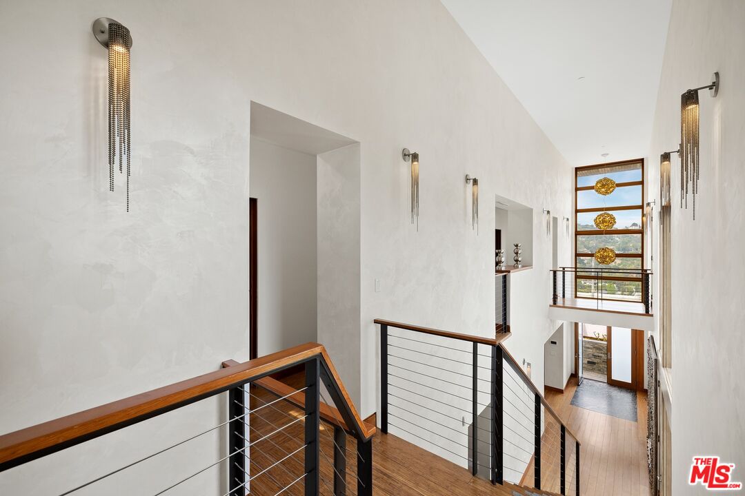2437 Apollo Drive Los Angeles, CA 90046 - Photo 10 of 27 a view of entryway with wooden floor and stairs