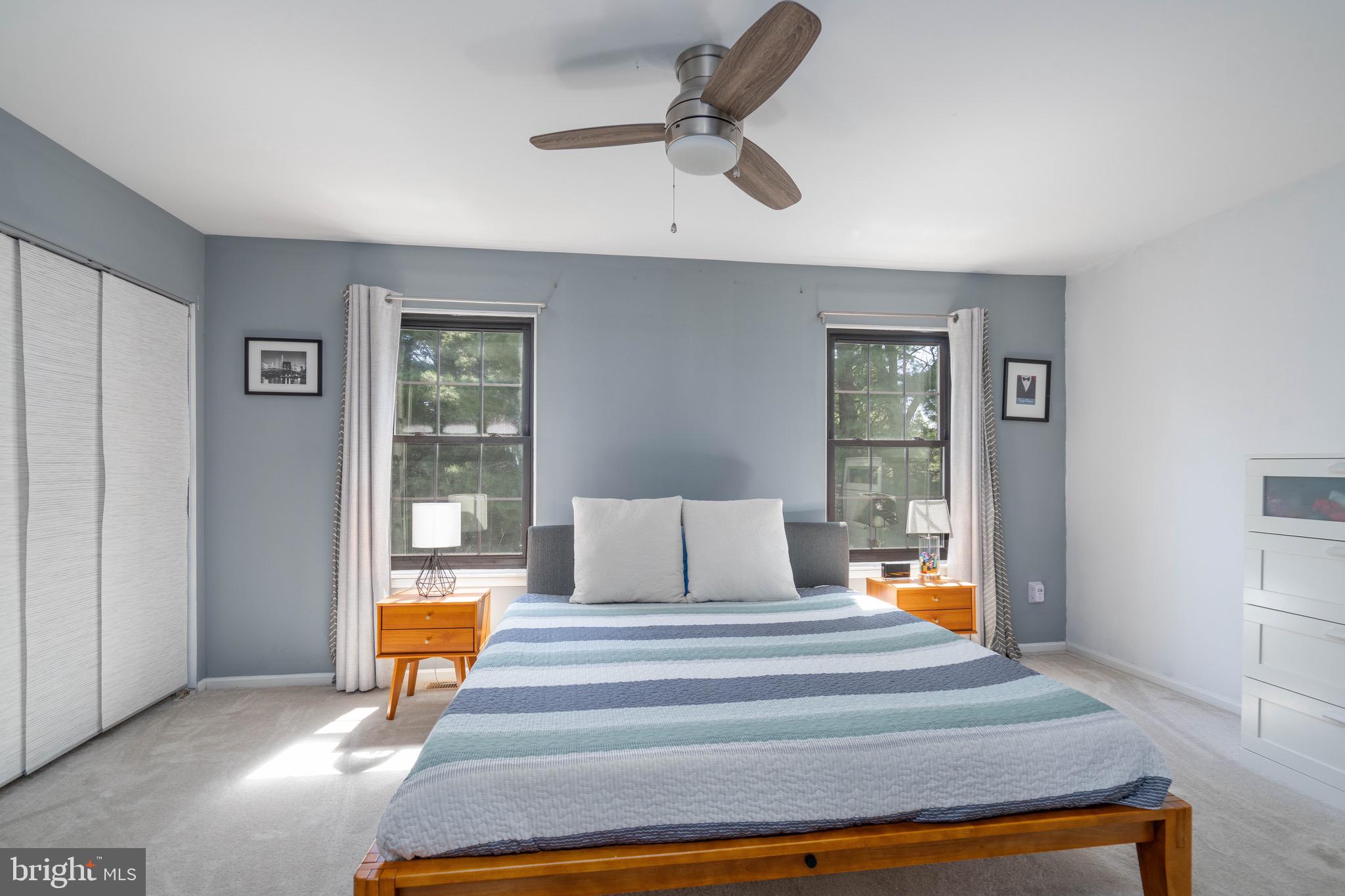 104 Bradbury Road Brookhaven, PA 19015 - Photo 21 of 29 a bedroom with a bed and a chandelier