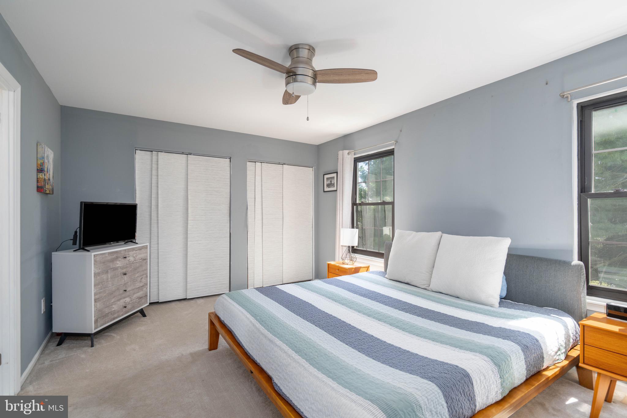 104 Bradbury Road Brookhaven, PA 19015 - Photo 22 of 29 a bedroom with a bed and a flat tv screen on dresser