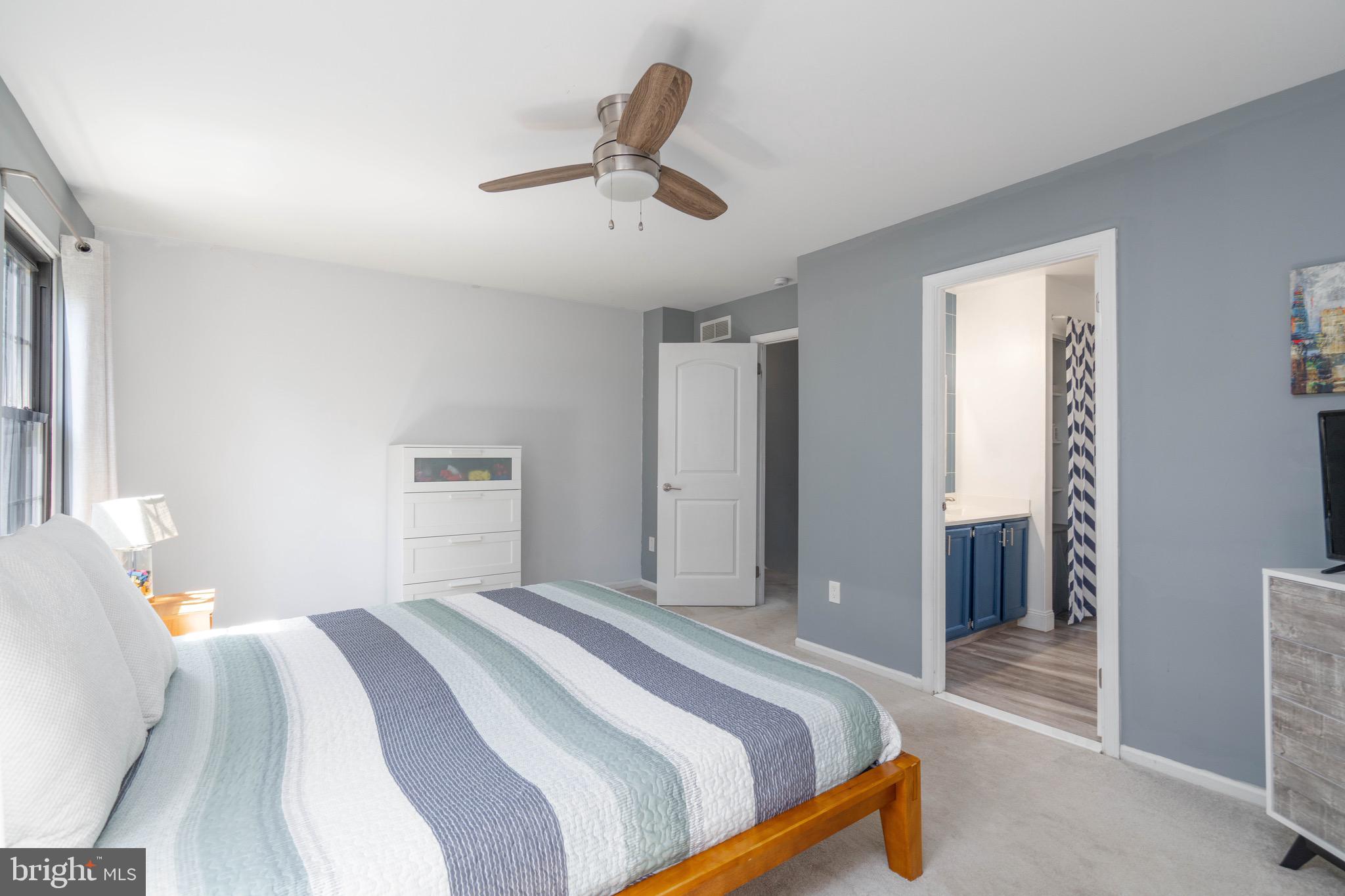 104 Bradbury Road Brookhaven, PA 19015 - Photo 23 of 29 a bedroom with a bed and a chandelier