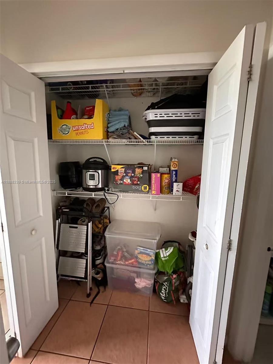 1021 Crystal Lake Drive, Unit 311 Deerfield Beach, FL 33064 - Photo 14 of 17 a room with storage and utility