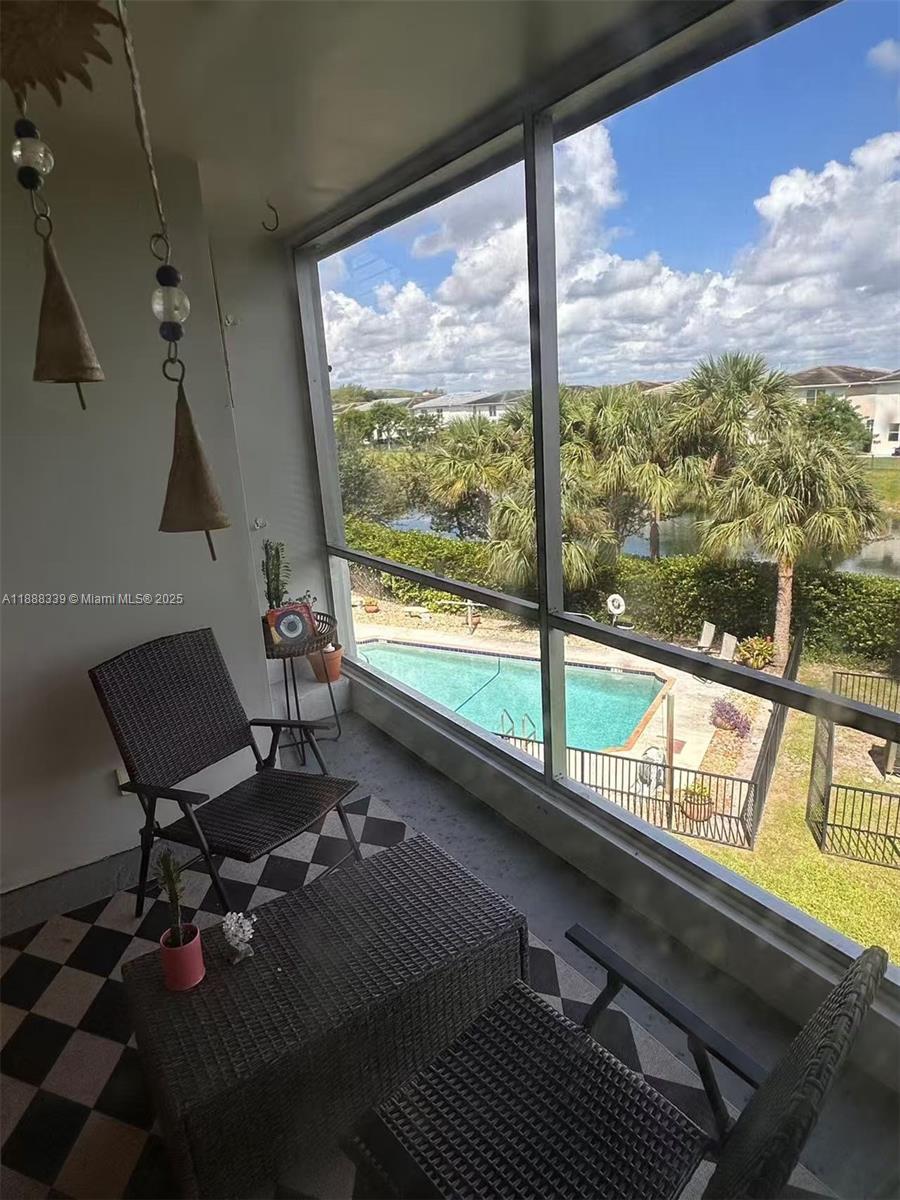 1021 Crystal Lake Drive, Unit 311 Deerfield Beach, FL 33064 - Photo 17 of 17 a living room with a large window