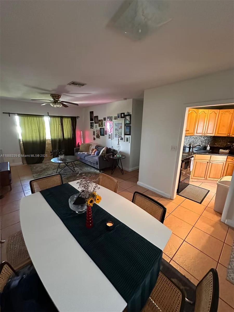 1021 Crystal Lake Drive, Unit 311 Deerfield Beach, FL 33064 - Photo 3 of 17 a room with furniture pool table and window