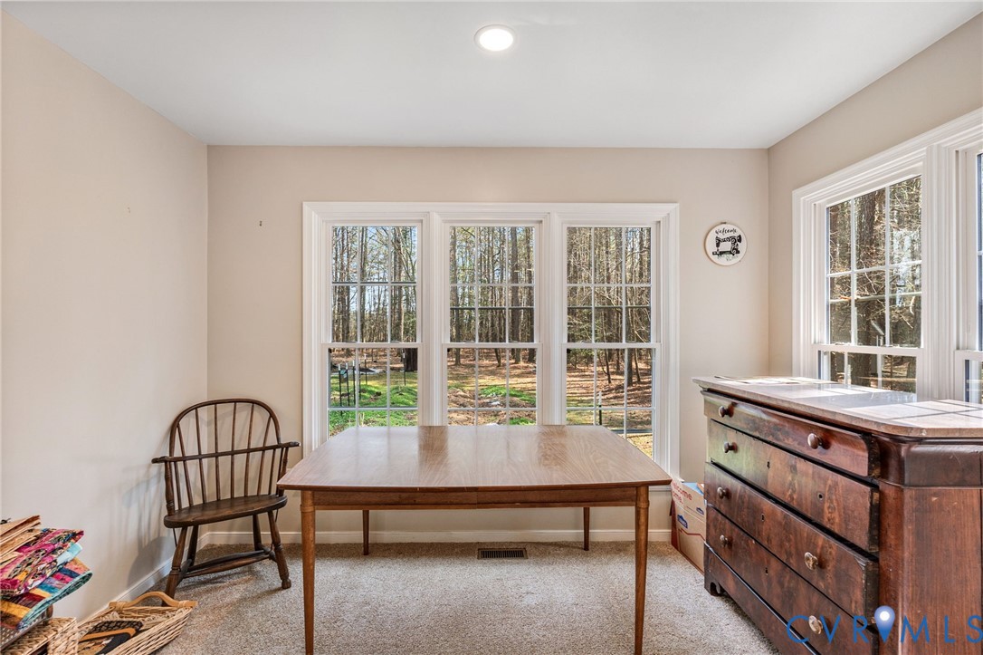 1373 Butler Branch Road Petersburg, VA 23805 - Photo 12 of 28 Dining space with light colored carpet and baseboa