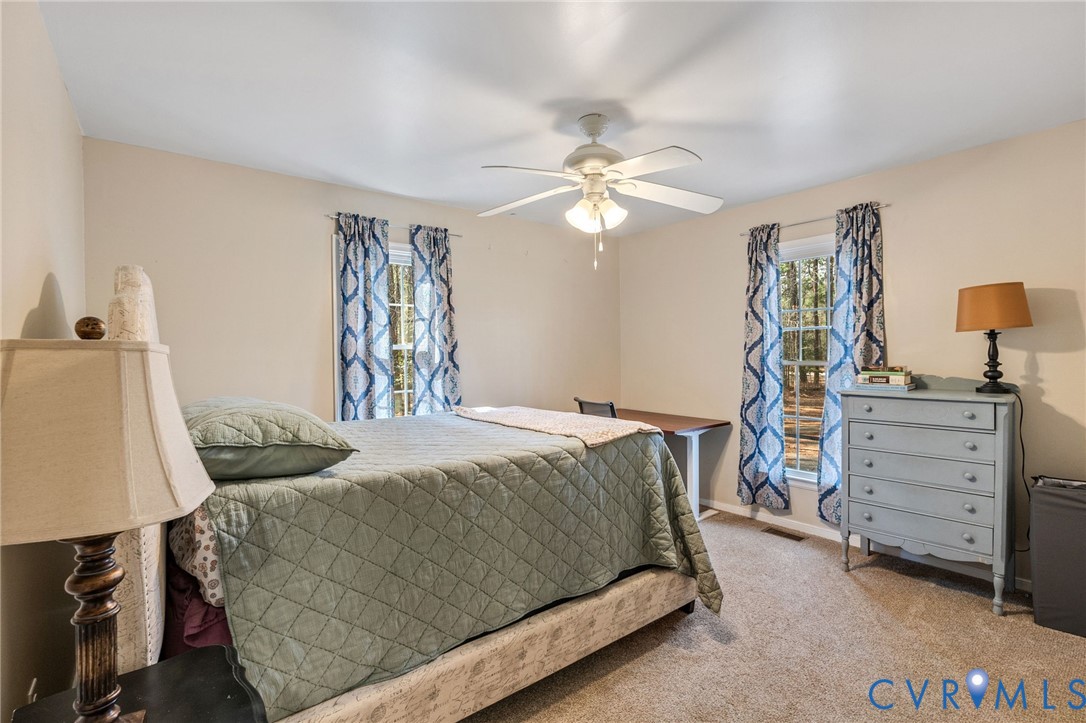1373 Butler Branch Road Petersburg, VA 23805 - Photo 13 of 28 Carpeted bedroom with a ceiling fan and baseboards