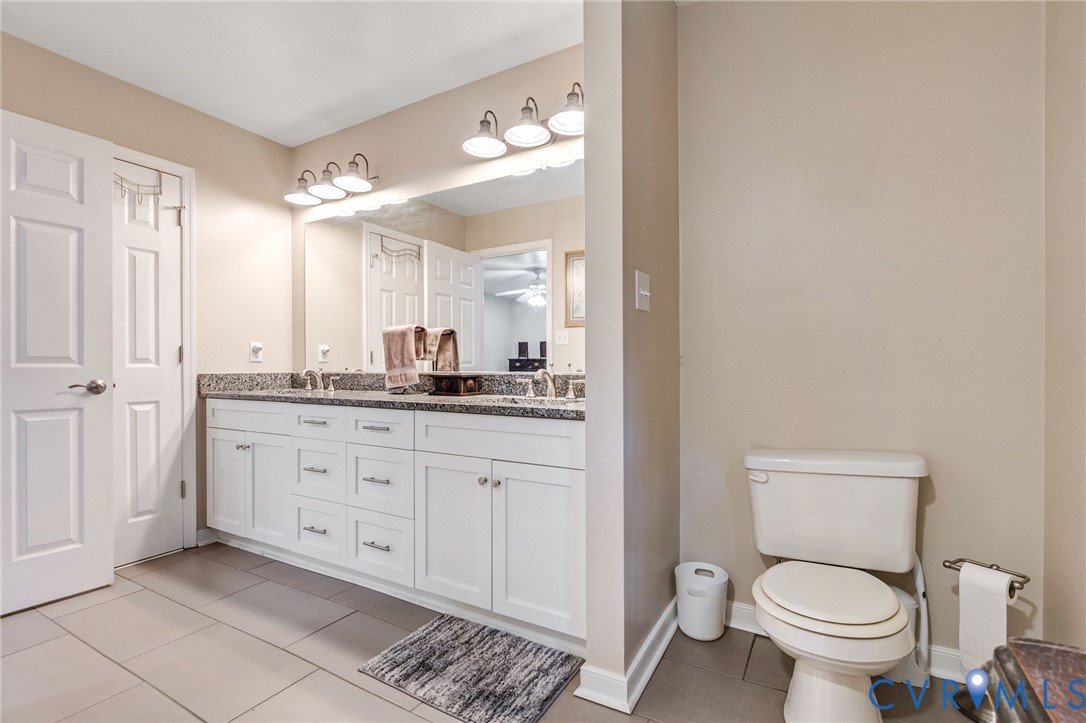 1373 Butler Branch Road Petersburg, VA 23805 - Photo 17 of 28 Full bath with double vanity and light tile patter