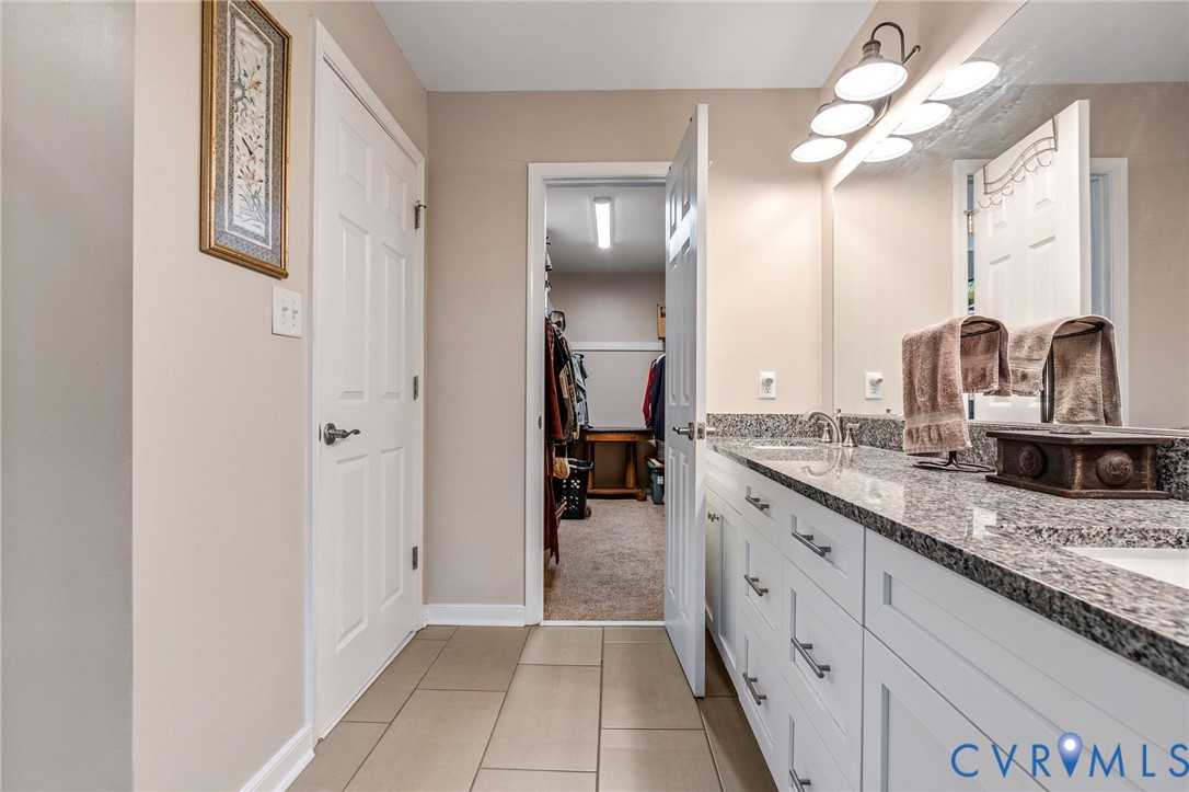 1373 Butler Branch Road Petersburg, VA 23805 - Photo 18 of 28 Full bathroom featuring double vanity and light ti