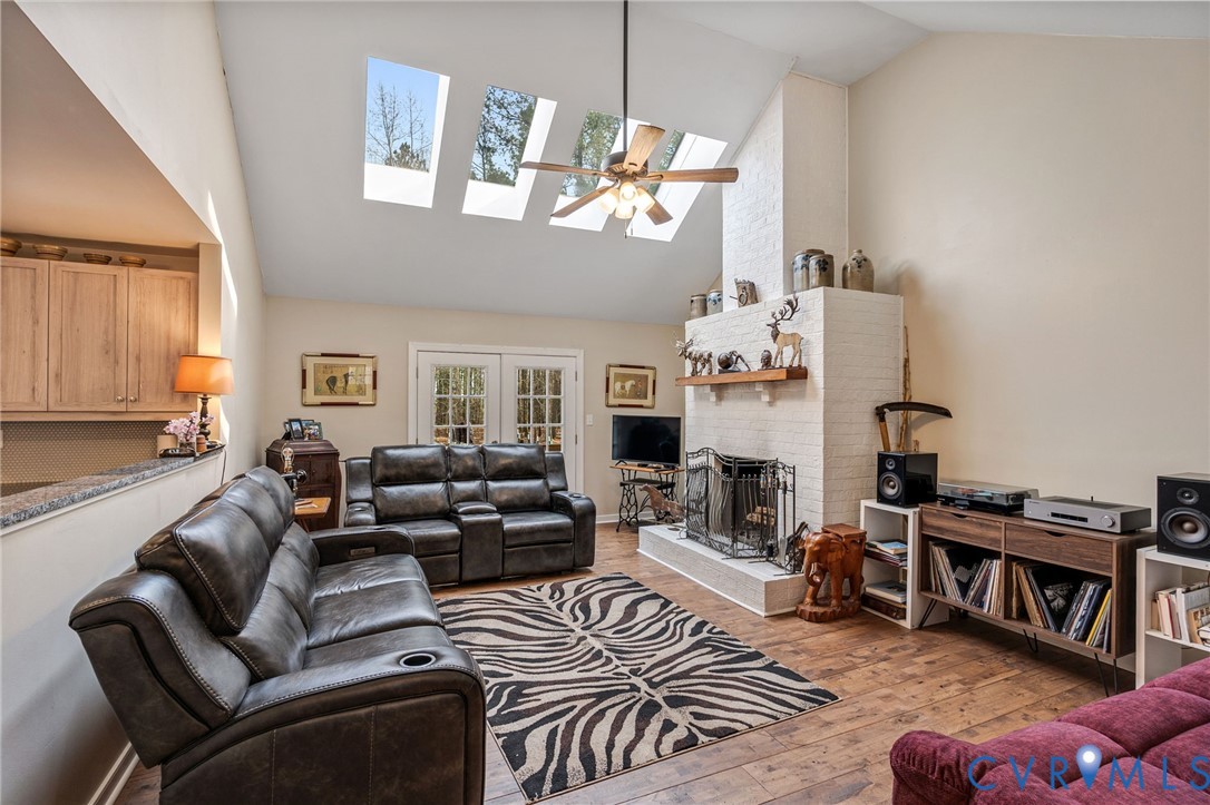 1373 Butler Branch Road Petersburg, VA 23805 - Photo 2 of 28 Living room featuring a skylight, light wood-type
