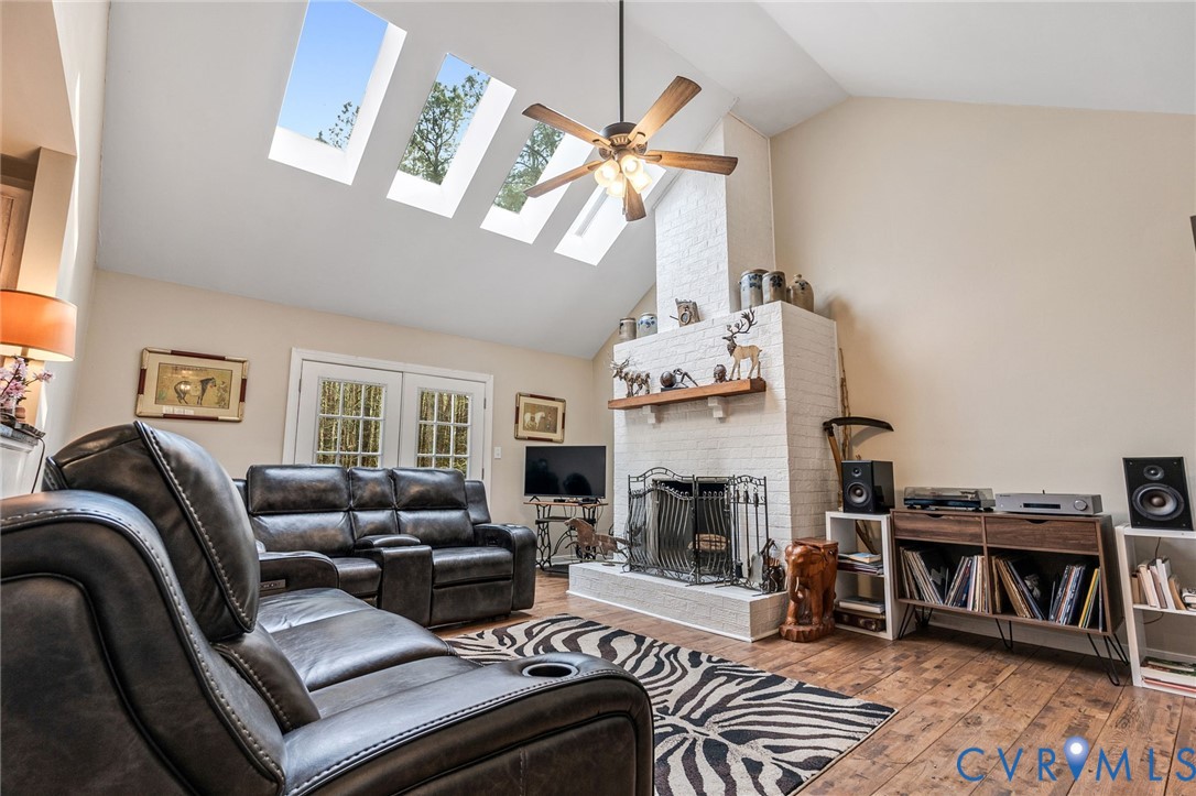 1373 Butler Branch Road Petersburg, VA 23805 - Photo 3 of 28 Living room with a skylight, vaulted ceiling, ceil