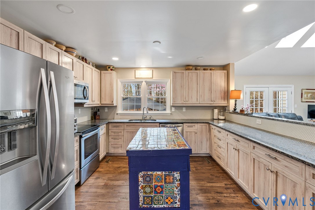 1373 Butler Branch Road Petersburg, VA 23805 - Photo 6 of 28 Kitchen with stainless steel appliances, light woo
