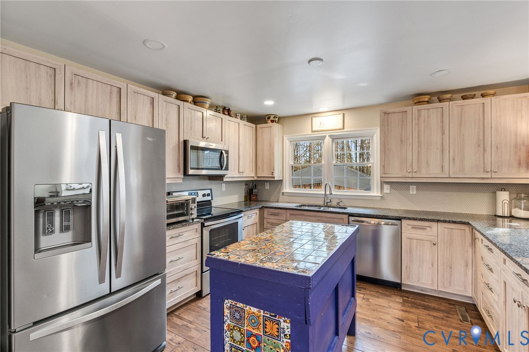 1373 Butler Branch Road Petersburg, VA 23805 - Photo 8 of 28 Kitchen featuring light wood finish cabinetry, sta