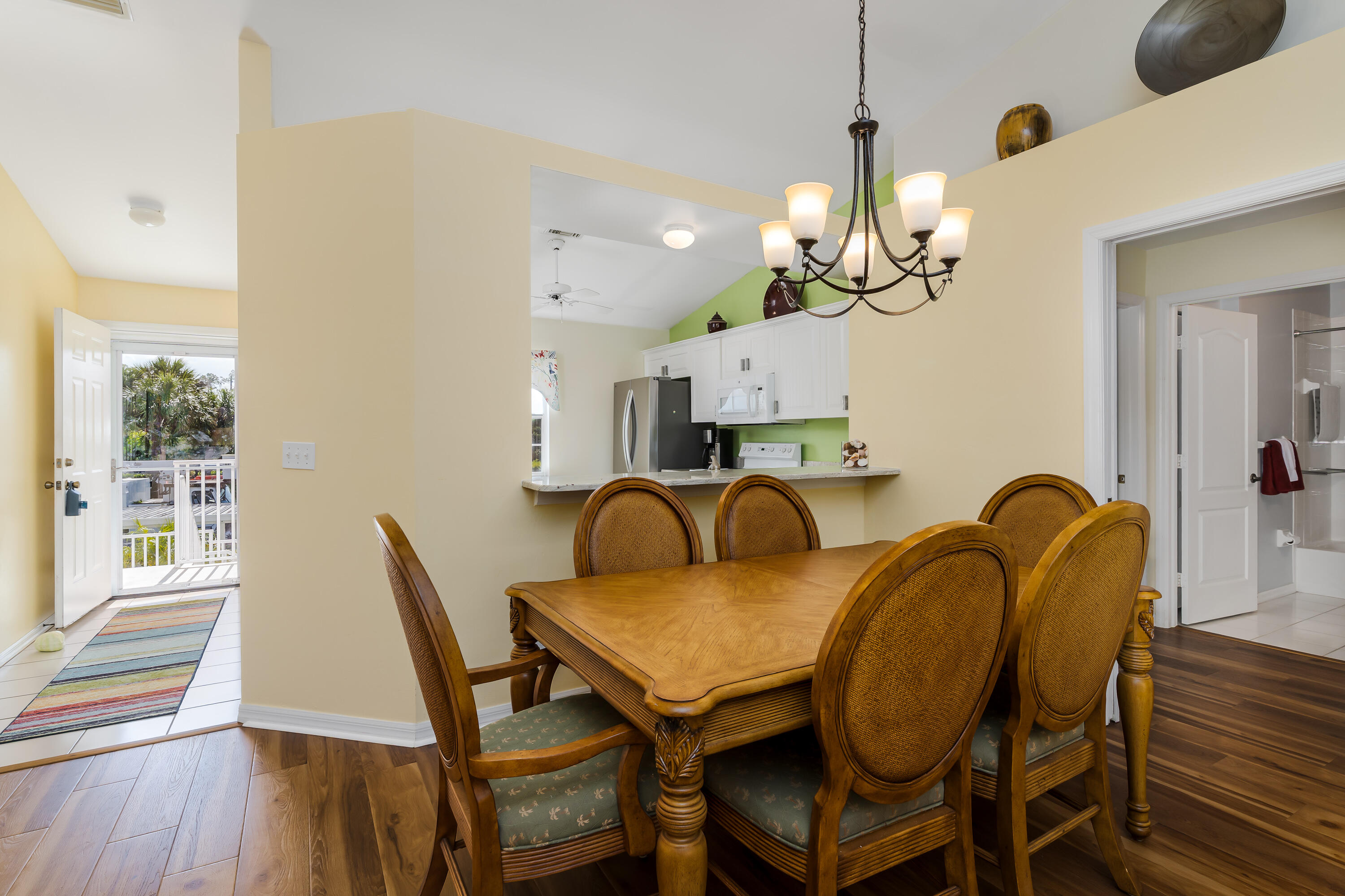 8065 Tiger Cove, Unit 1611 Naples, FL 34113 - Photo 8 of 40 Entry Hallway and dining table