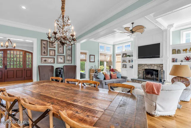 a living room with a fireplace a flat screen tv and a fireplace