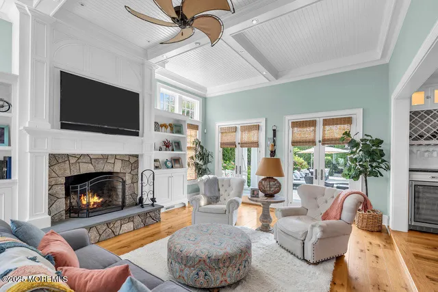 a spacious bedroom with a bed and fireplace