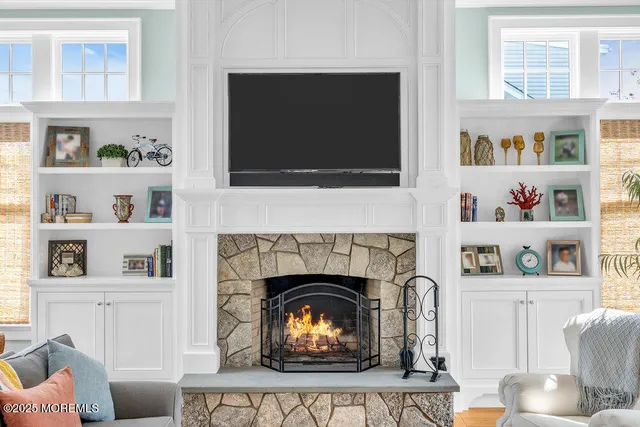 a white toilet sitting next to a bathroom sink and vanity