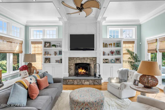a bathroom with a granite countertop sink mirror vanity and toilet