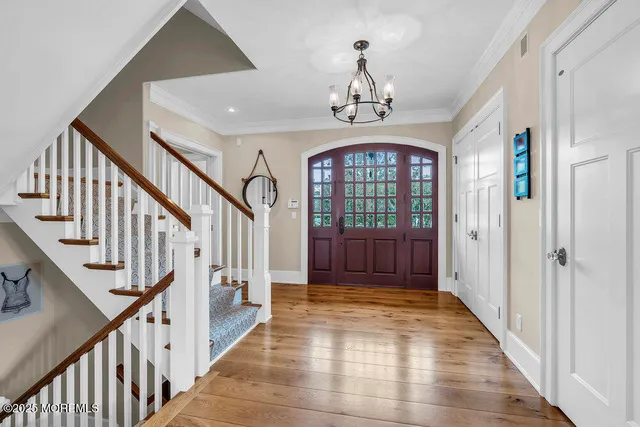 a bathroom with a granite countertop toilet sink and mirror