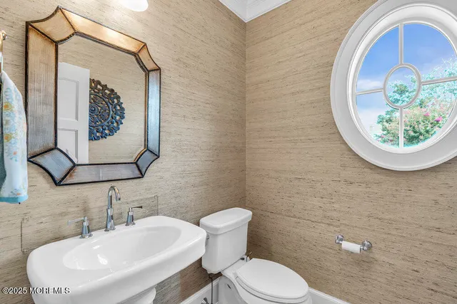 a bathroom with a shower and a sink