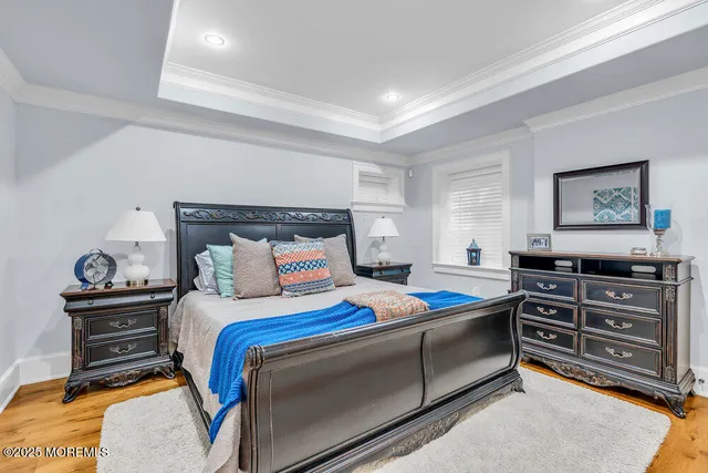 a bathroom with a granite countertop sink mirror vanity and toilet