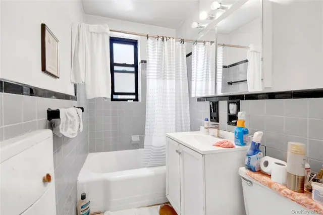 a bedroom with bed and a mirror