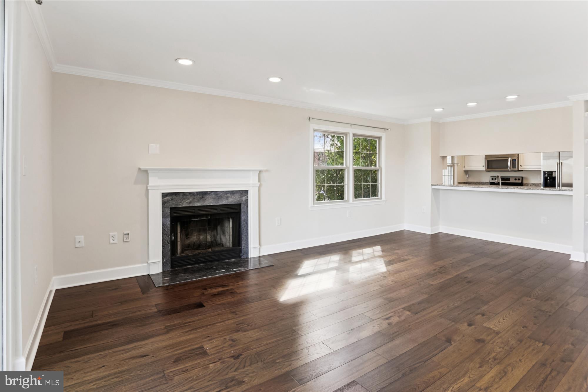 945 South Scott Street Arlington, VA 22204 - Photo 13 of 39 a view of a room with wooden floor and a fireplace