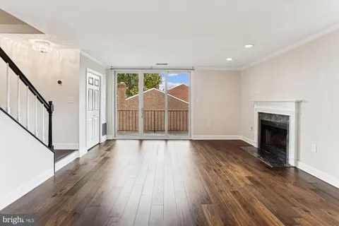 wooden floor in an empty room with a fireplace