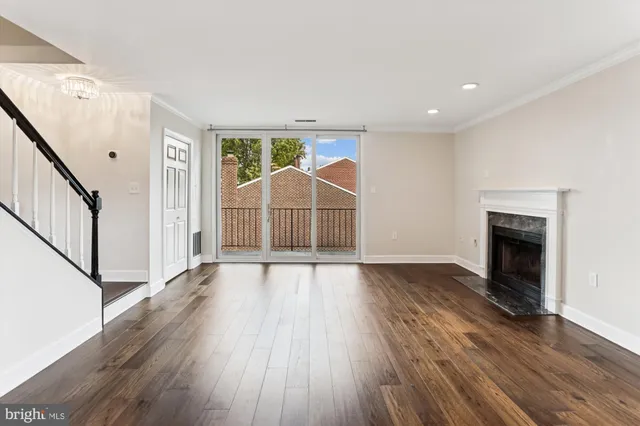 wooden floor in an empty room with a fireplace