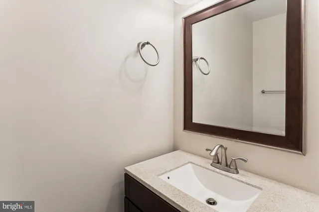 a bathroom with a sink and mirror