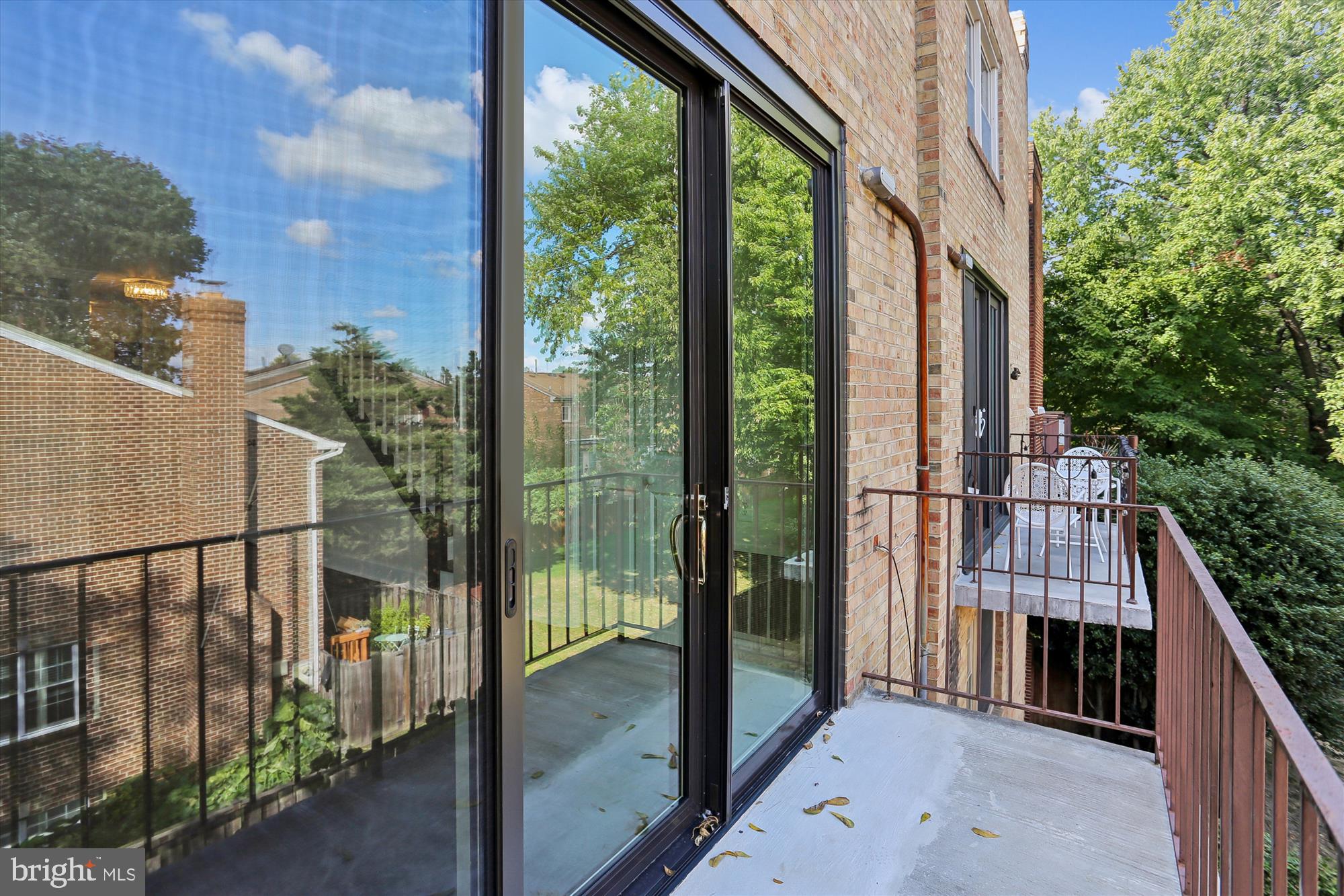 945 South Scott Street Arlington, VA 22204 - Photo 17 of 39 a view of balcony with floor to ceiling window and wooden fence