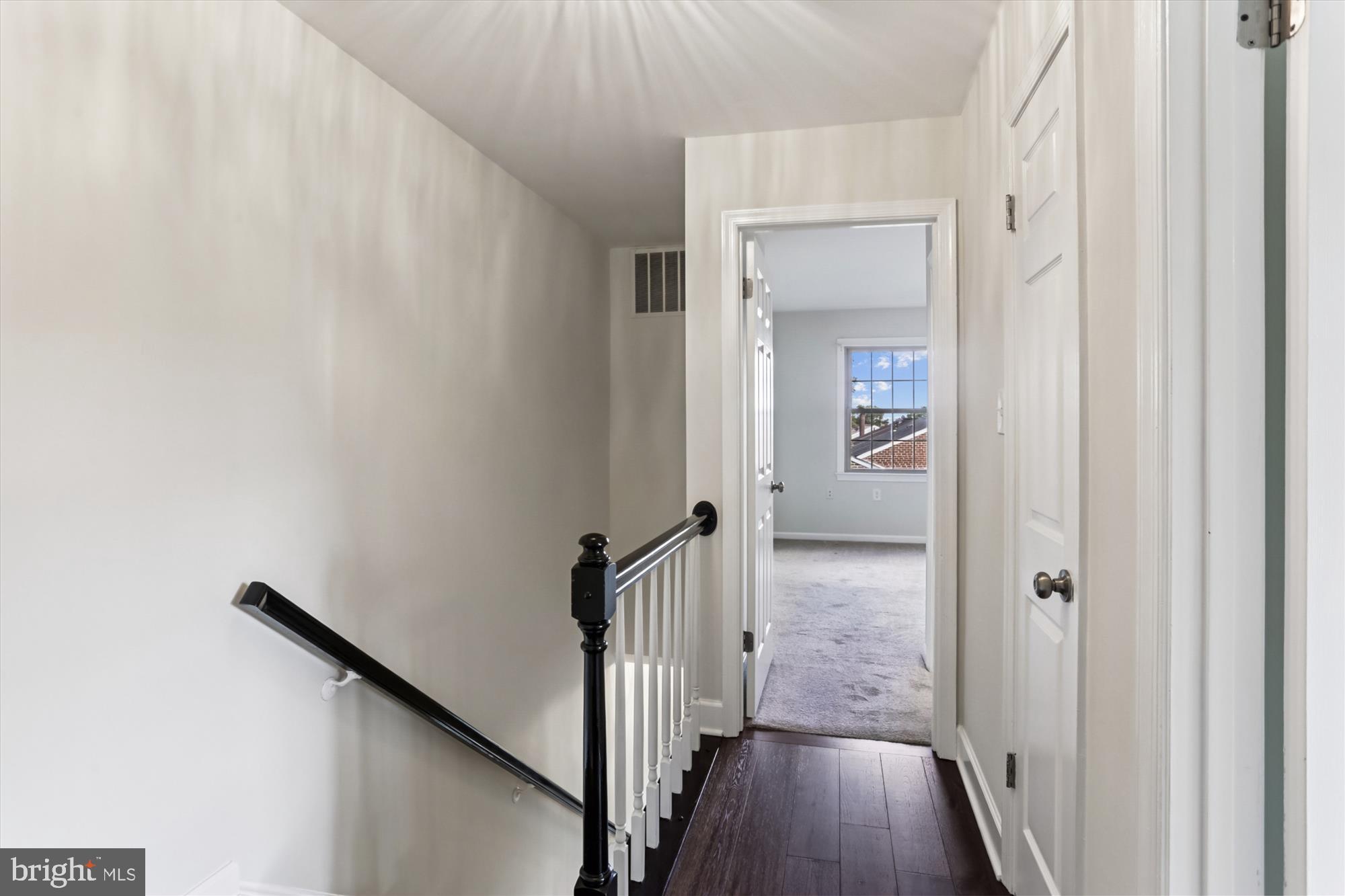 945 South Scott Street Arlington, VA 22204 - Photo 21 of 39 a view of a hallway with wooden floor and staircase