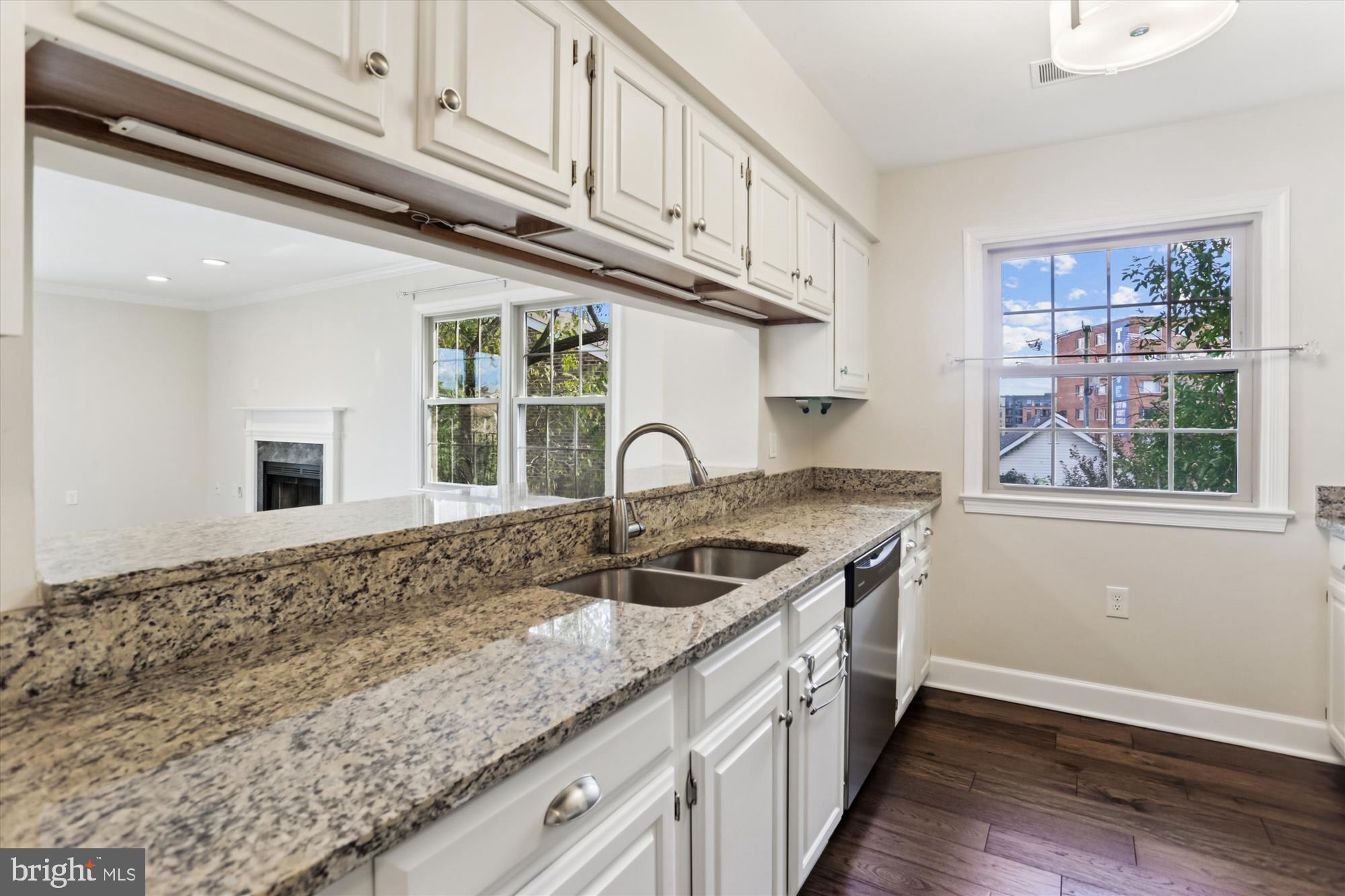 945 South Scott Street Arlington, VA 22204 - Photo 5 of 39 a kitchen with granite countertop a sink and a window