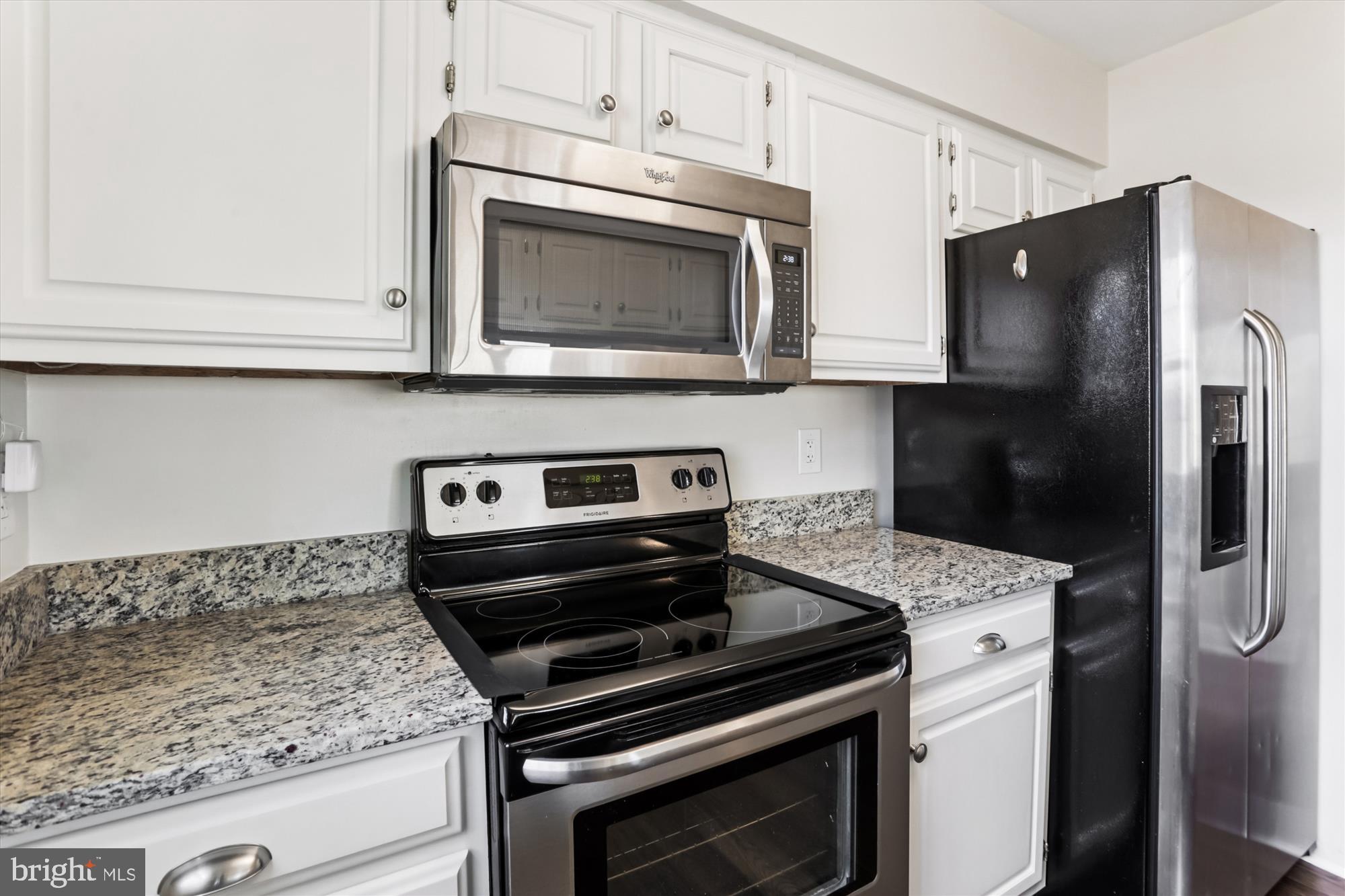 945 South Scott Street Arlington, VA 22204 - Photo 9 of 39 a kitchen with a stove microwave and refrigerator